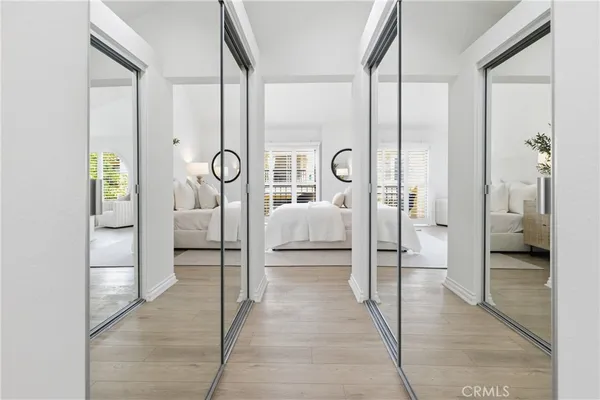 a bathroom with a glass door shower and a sink