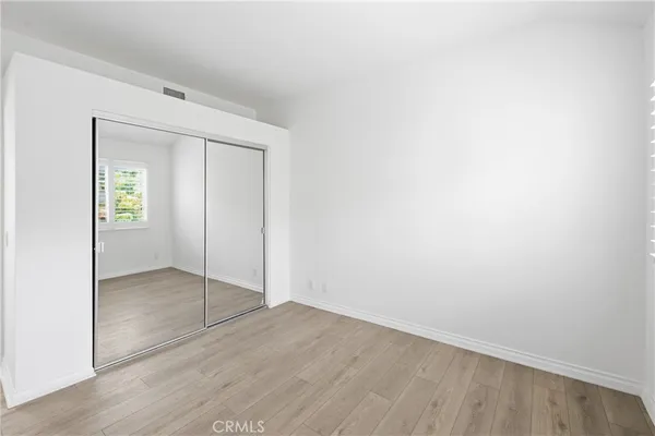 an empty room with closet area
