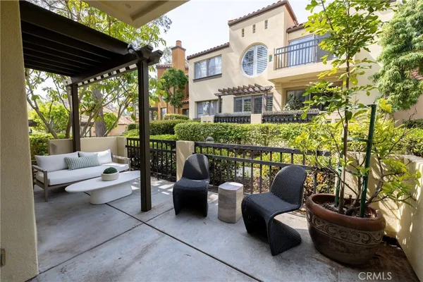 a outdoor living space with patio furniture and a potted plant