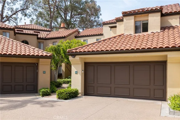 a front view of a house with a garage