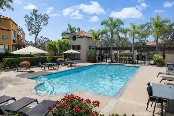 a view of a swimming pool with chairs