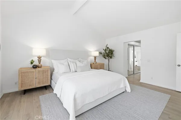 a bedroom with a bed and a dresser