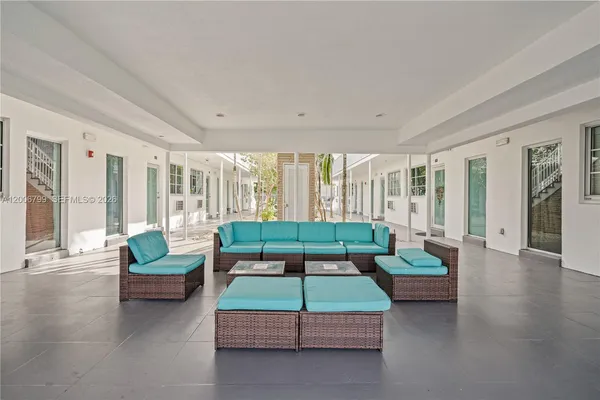 a living room with furniture and a large window