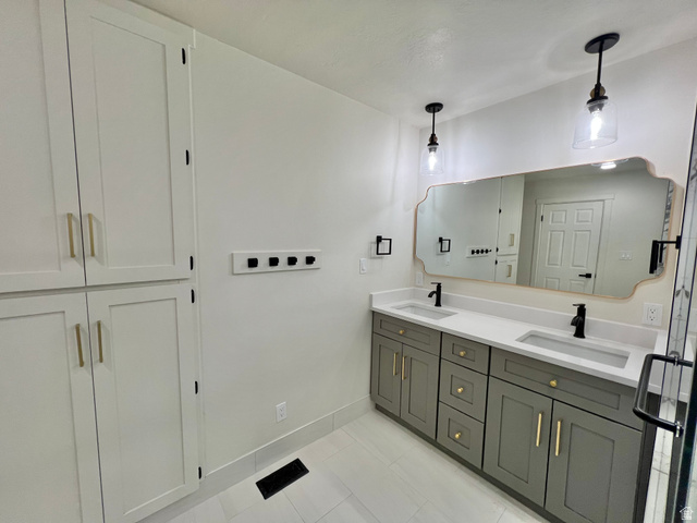 812 East Bates Cyn Road Tooele, UT 84074 - Photo 42 of 144 Dual vanity with integrated sinks and a light-colored countertop
