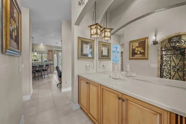 a spacious bathroom with a granite countertop sink a large mirror and a shower