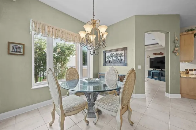 a kitchen with granite countertop white cabinets and sink