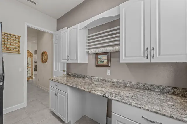 a spacious bathroom with a toilet a sink and bathtub