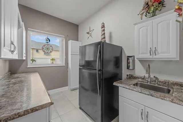 a spacious bathroom with a double vanity sink a mirror a bathtub and shower