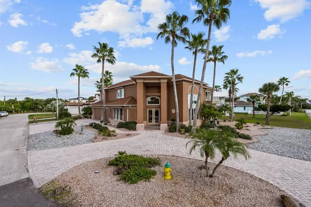 a view of hall way with furniture and a window