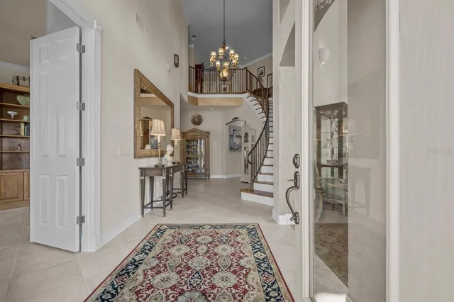 a view of a livingroom with workspace and a window