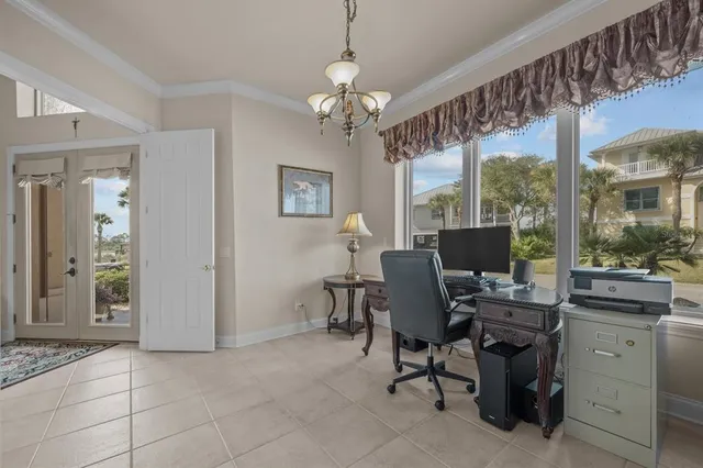 a living room with fireplace furniture and a floor to ceiling window