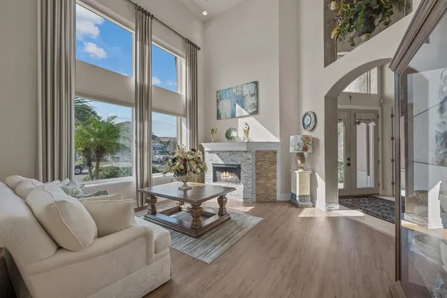 a view of a dining room with furniture wooden floor and chandelier