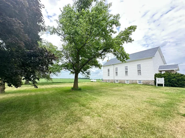 a view of a house with a big yard