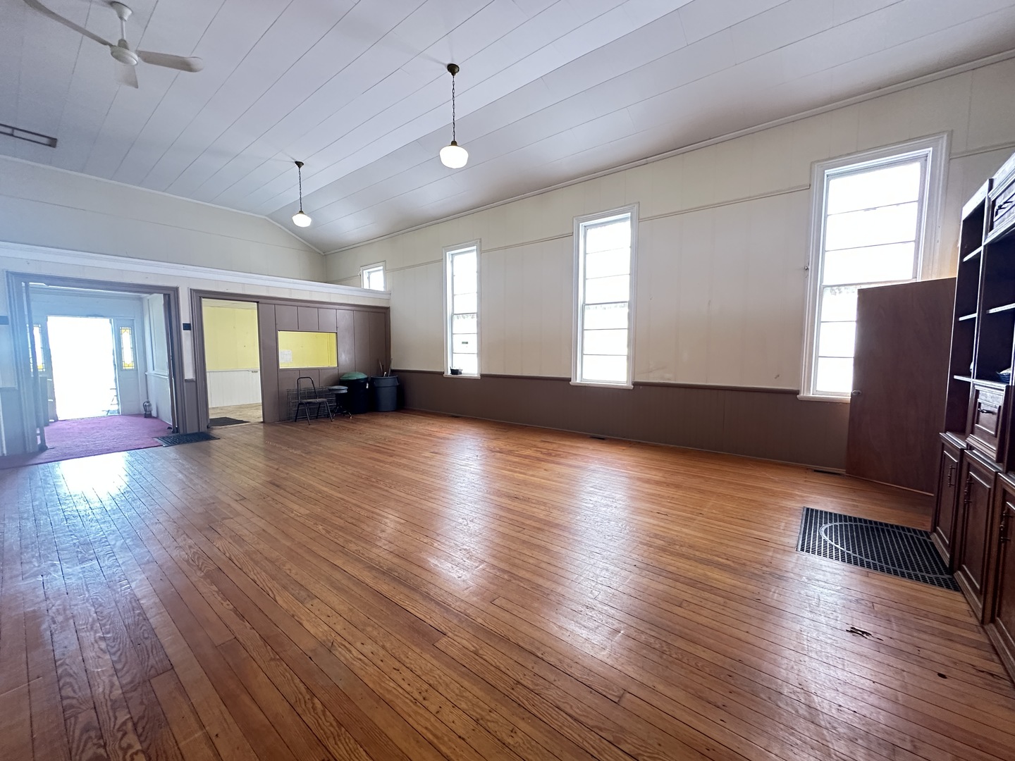 21027 Prairie Chapel Road Farmer City, IL 61842 - Photo 7 of 16 an empty room with wooden floor and windows