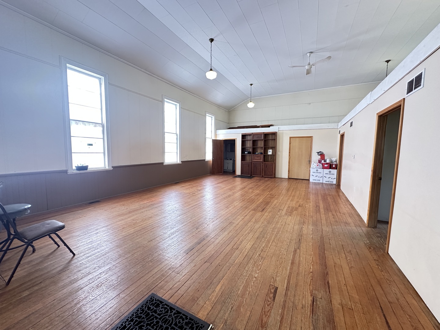 21027 Prairie Chapel Road Farmer City, IL 61842 - Photo 8 of 16 a view of an empty room with wooden floor and a window