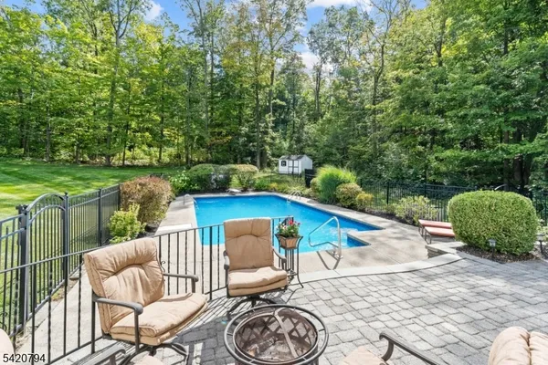 a view of a chairs and table in the patio