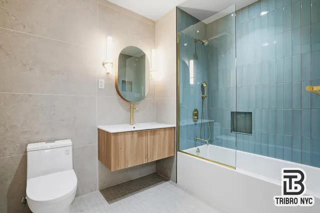 a bathroom with a toilet a sink and bathtub