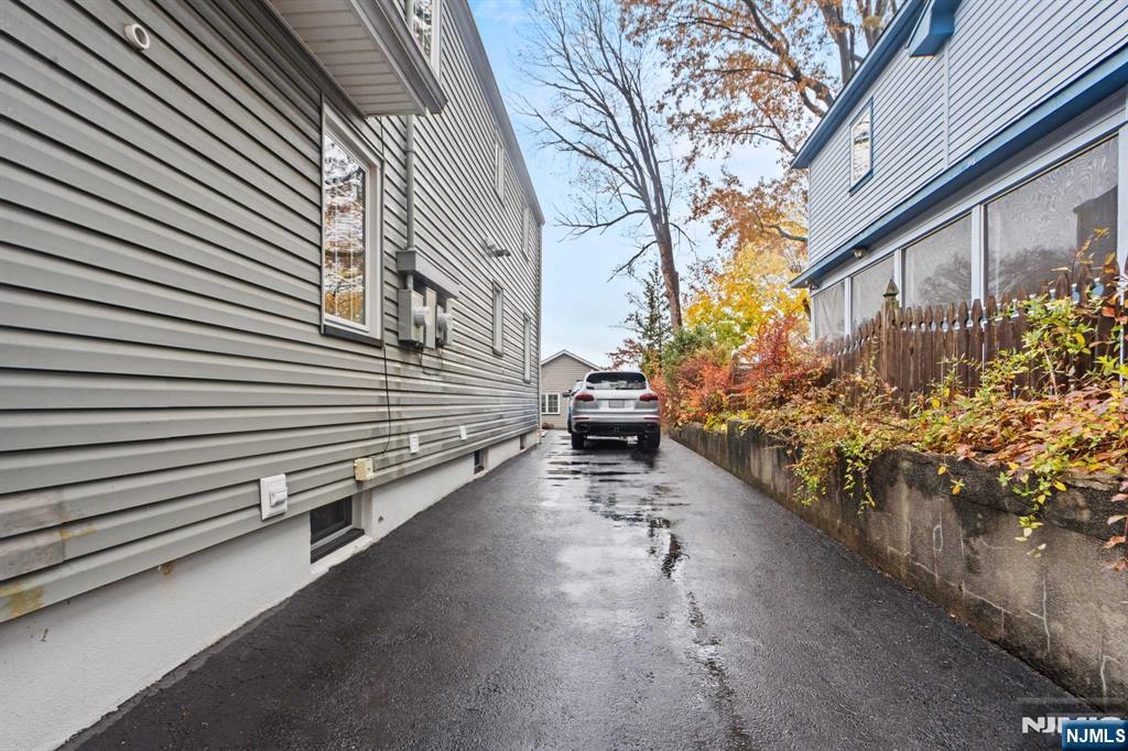 238 Springfield Avenue, Unit 1 Rutherford, NJ 07070 - Photo 25 of 33 a view of a house with a yard and a street