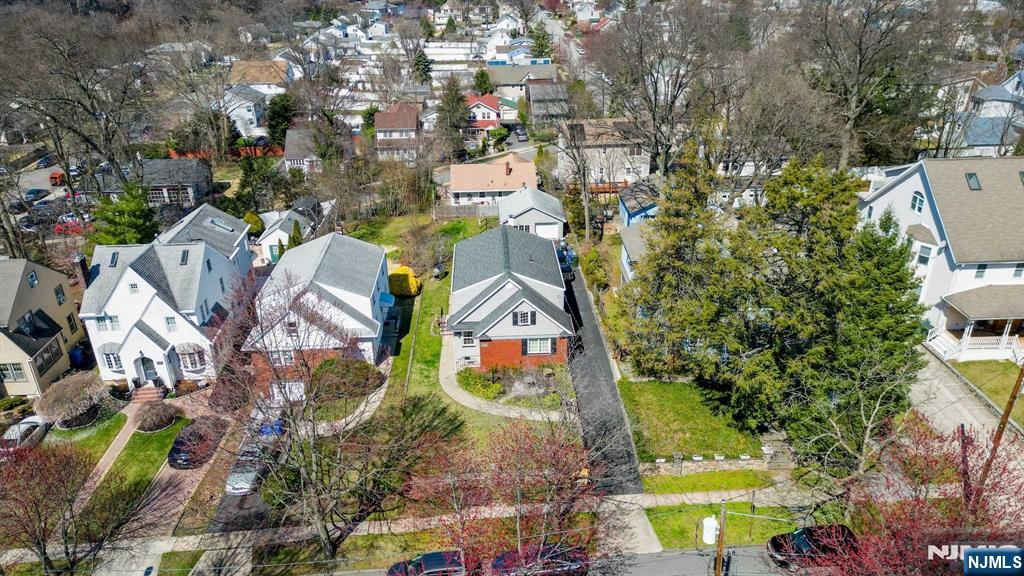 238 Springfield Avenue, Unit 1 Rutherford, NJ 07070 - Photo 27 of 33 an aerial view of residential house with outdoor space and parking