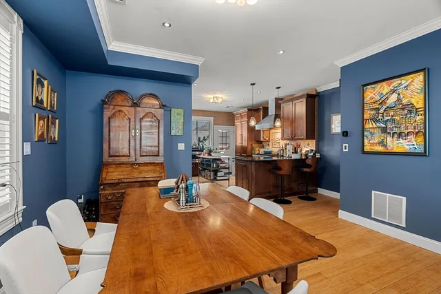 a dining room with a table and chairs