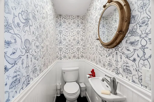 a bathroom with a toilet and a sink