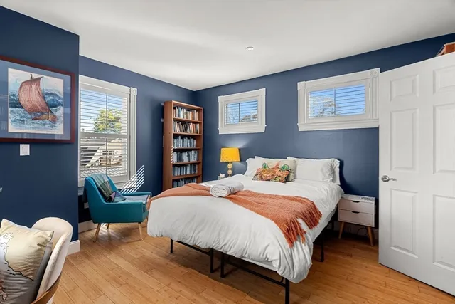 a bedroom with a bed and a couch