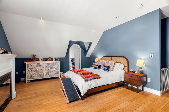 a bedroom with a bed and dresser