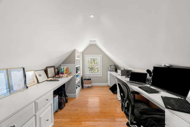 a view of a workspace with furniture