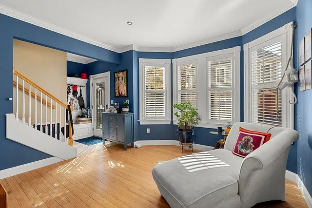 a living room with furniture and windows