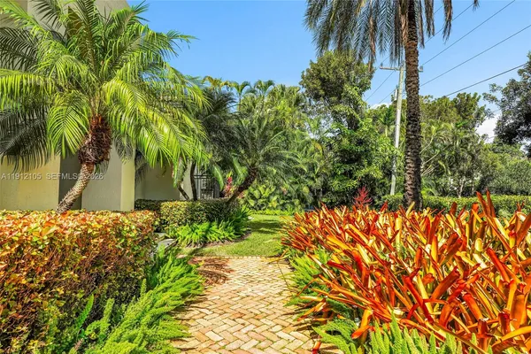 a view of a dining room with furniture wooden floor and chandelier