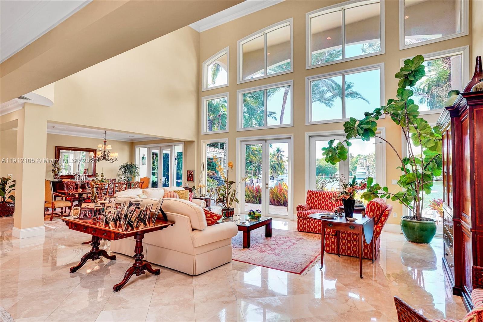 550 Harbor Drive Key Biscayne, FL 33149 - Photo 19 of 65 a living room with furniture and floor to ceiling windows