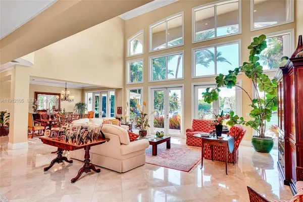 a view of a hallway with furniture and a livingroom