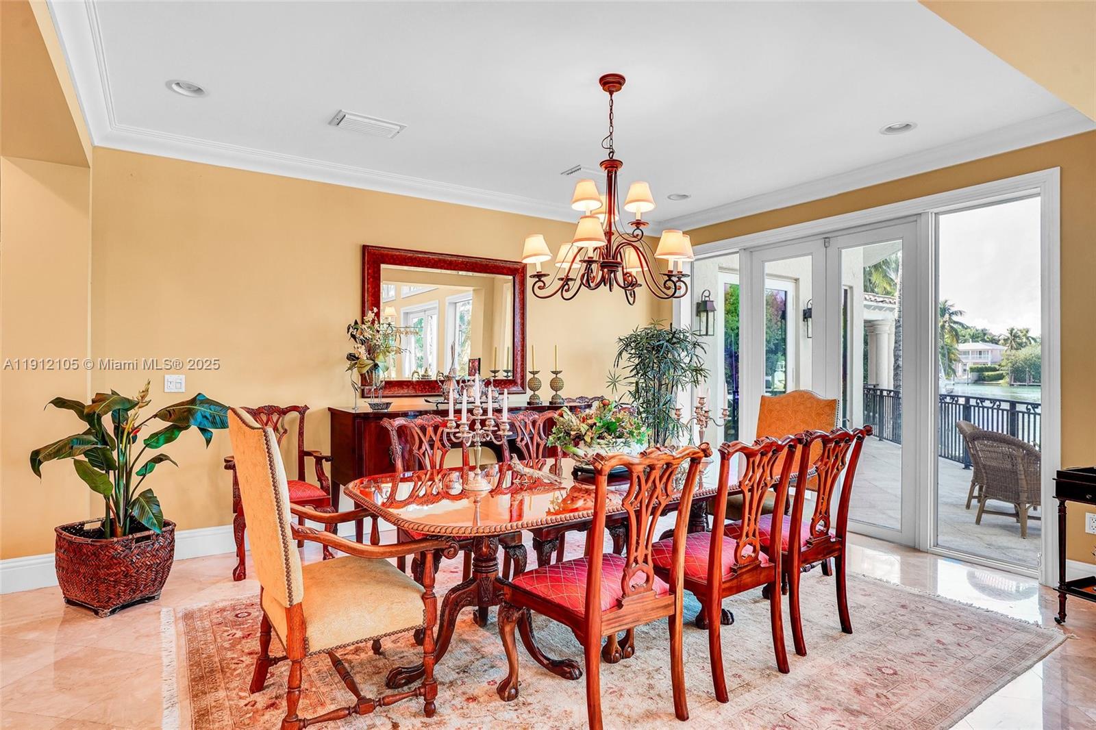 550 Harbor Drive Key Biscayne, FL 33149 - Photo 23 of 65 a view of a dining room with furniture wooden floor and chandelier