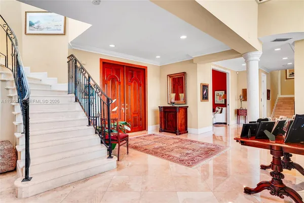 a bedroom with two beds and a large window