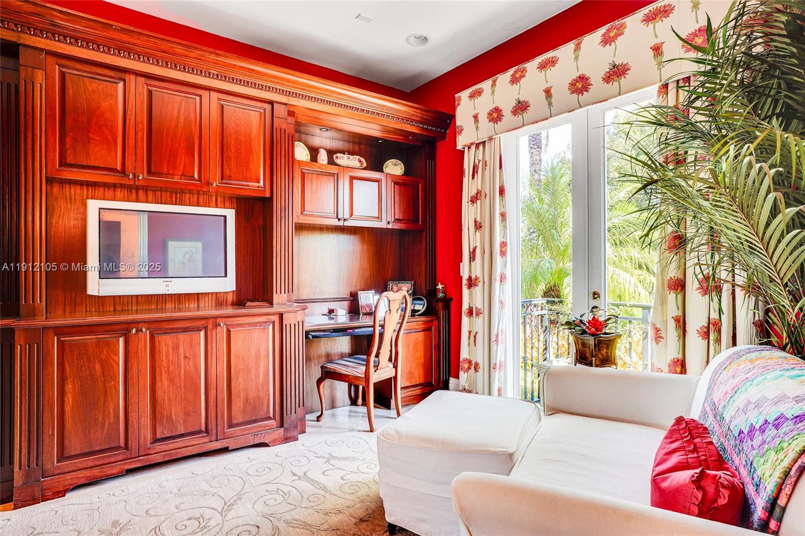 550 Harbor Drive Key Biscayne, FL 33149 - Photo 30 of 65 a living room with furniture a large window and bookshelf