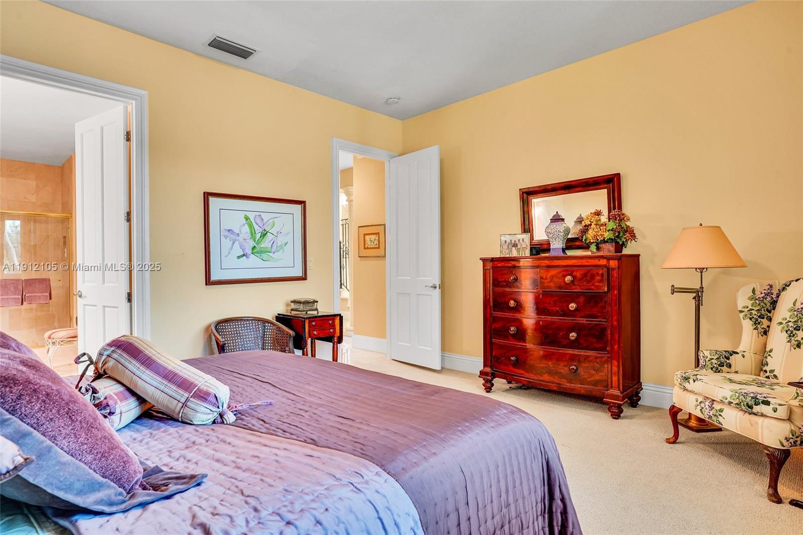 550 Harbor Drive Key Biscayne, FL 33149 - Photo 32 of 65 a bedroom with a bed and a dresser in it