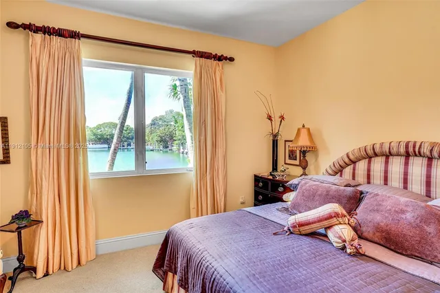 a bathroom with a large tub a toilet and a shower