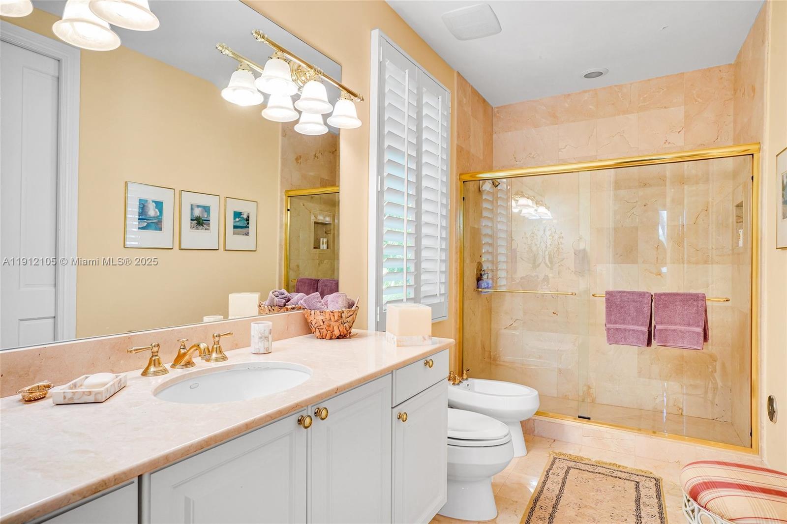 550 Harbor Drive Key Biscayne, FL 33149 - Photo 34 of 65 a bathroom with a granite countertop sink mirror vanity bathtub and toilet