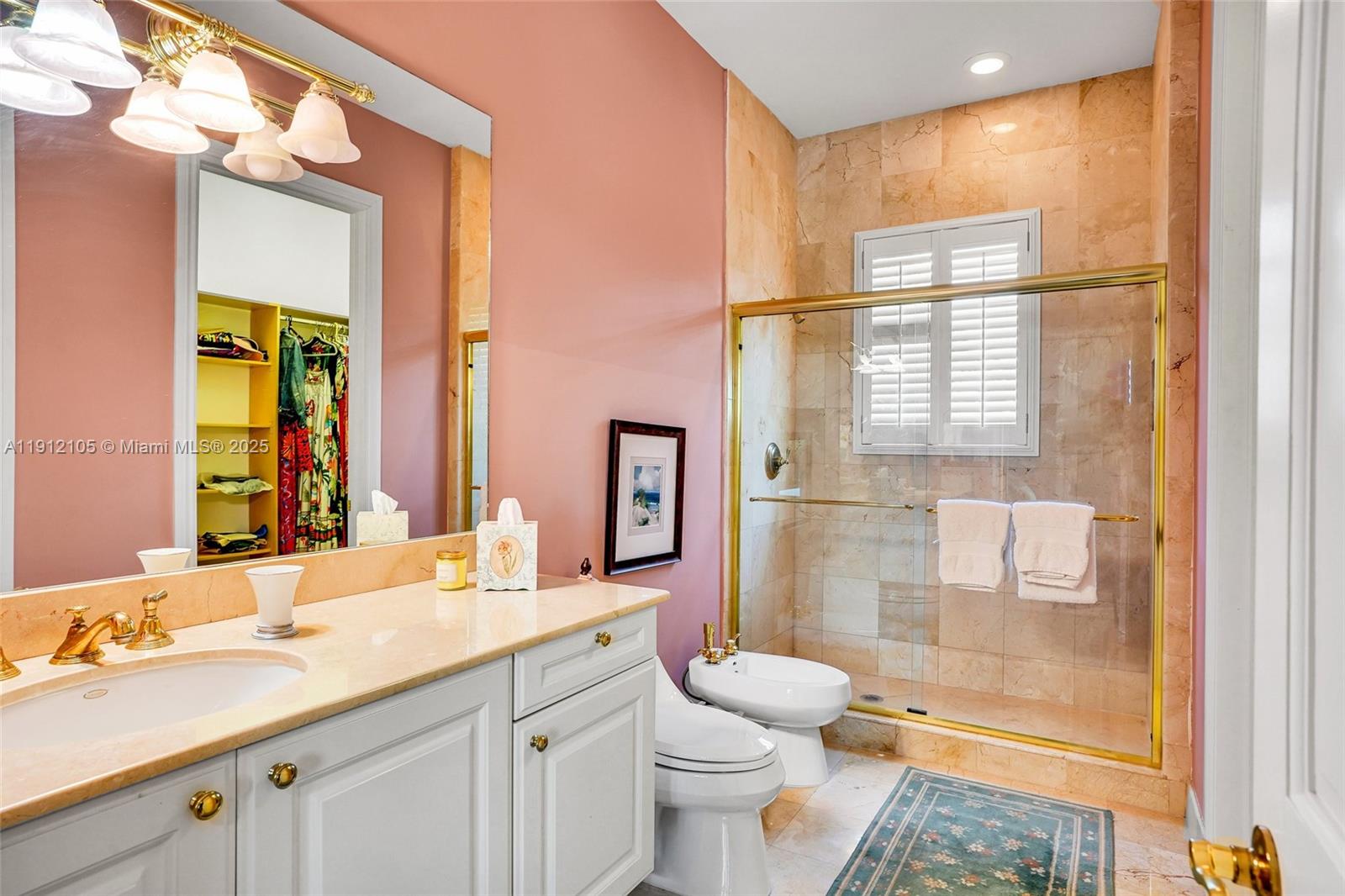 550 Harbor Drive Key Biscayne, FL 33149 - Photo 37 of 65 a bathroom with a granite countertop sink toilet and shower