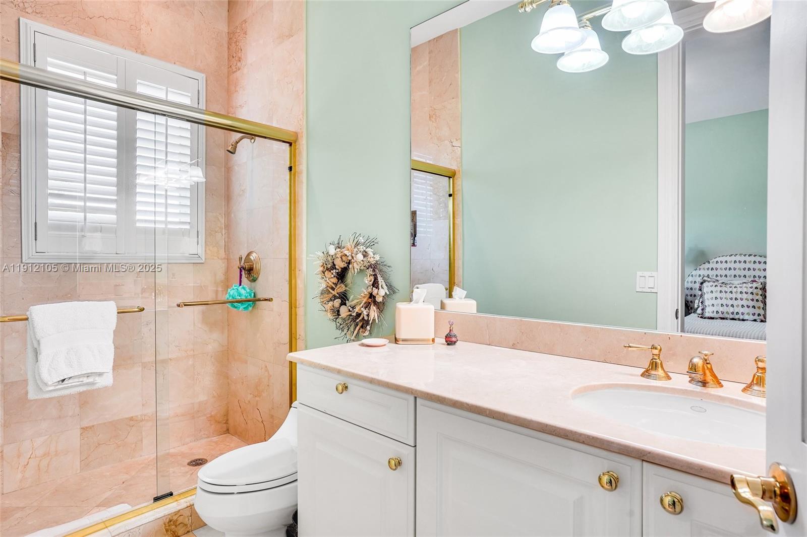 550 Harbor Drive Key Biscayne, FL 33149 - Photo 40 of 65 a bathroom with a sink a toilet and shower