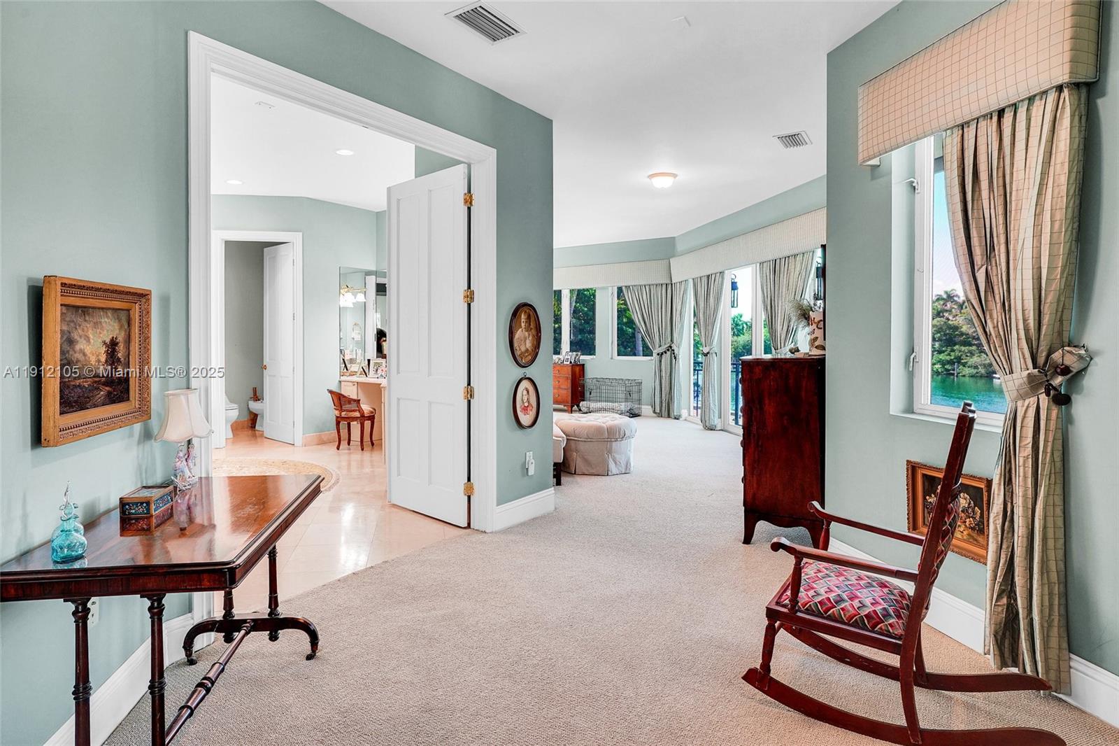 550 Harbor Drive Key Biscayne, FL 33149 - Photo 43 of 65 a living room with furniture a flat screen tv and a refrigerator