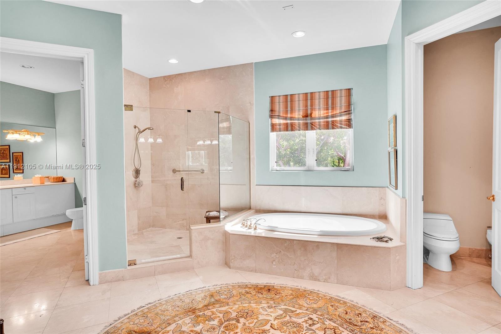 550 Harbor Drive Key Biscayne, FL 33149 - Photo 45 of 65 a bathroom with a large tub a toilet and a shower