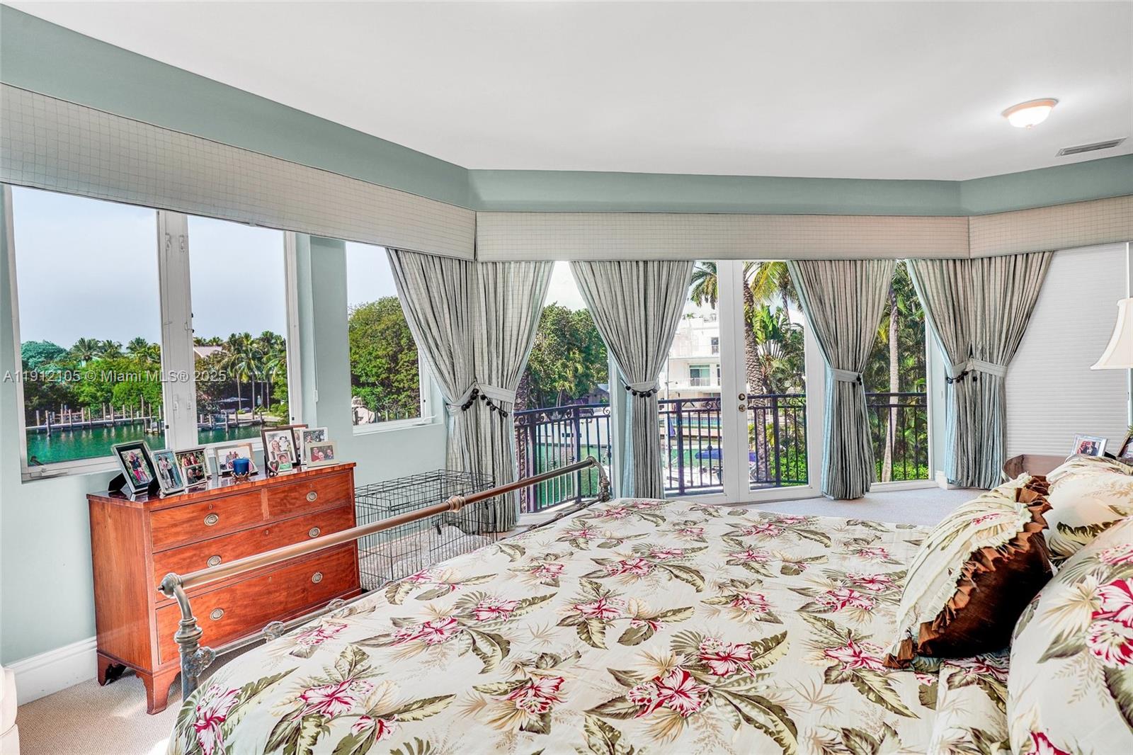 550 Harbor Drive Key Biscayne, FL 33149 - Photo 49 of 65 a bed sitting in a bedroom next to a large window