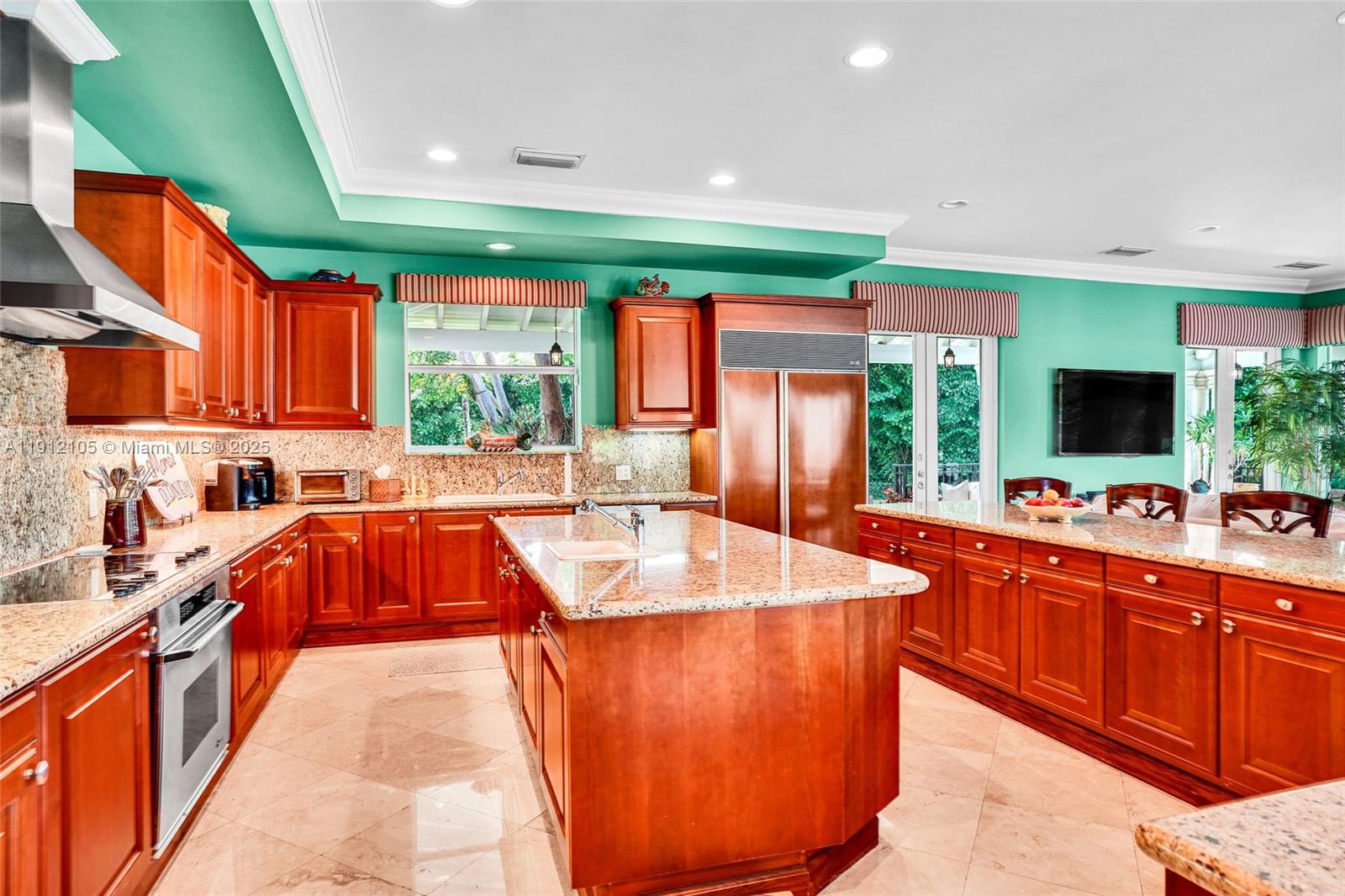 550 Harbor Drive Key Biscayne, FL 33149 - Photo 52 of 65 a kitchen with stainless steel appliances granite countertop sink stove top oven and cabinets