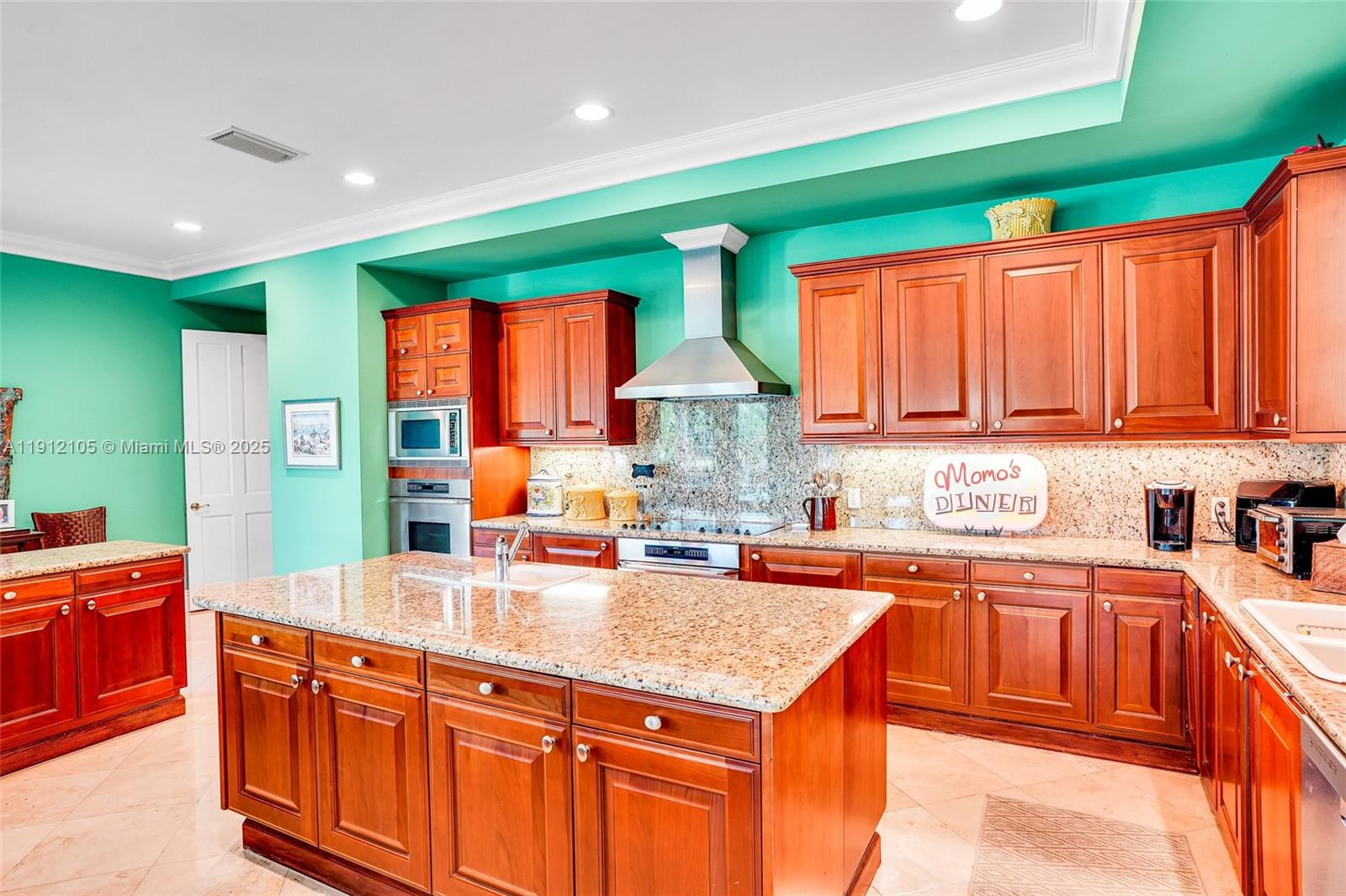 550 Harbor Drive Key Biscayne, FL 33149 - Photo 56 of 65 a kitchen with stainless steel appliances a sink stove and cabinets