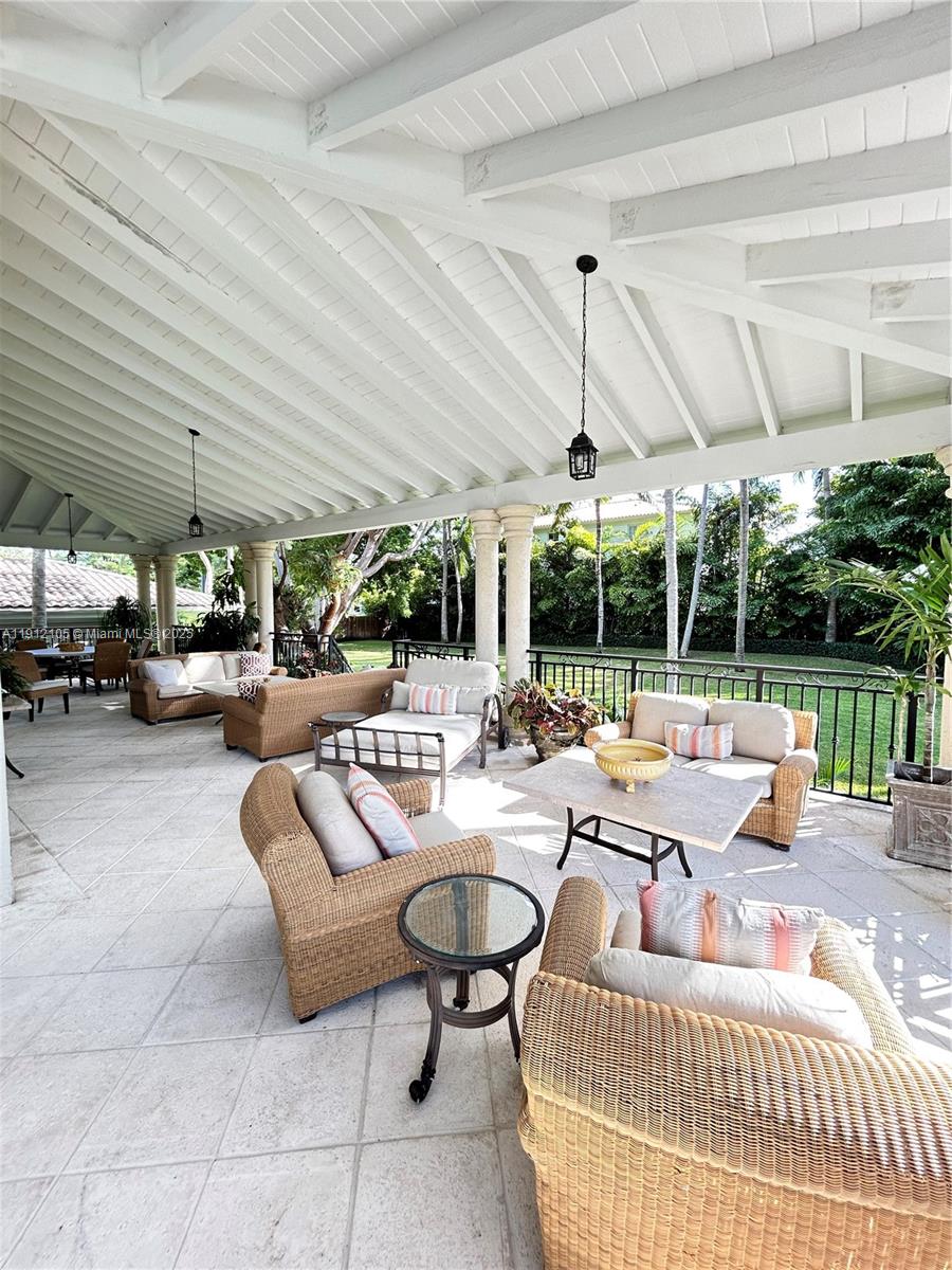 550 Harbor Drive Key Biscayne, FL 33149 - Photo 63 of 65 a outdoor space with patio the couches and a dining table with garden view