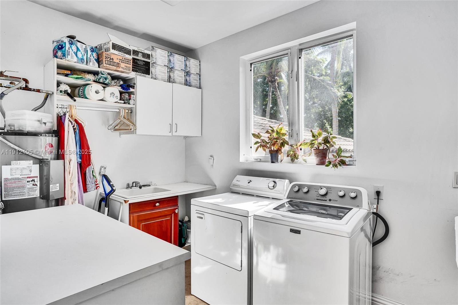 550 Harbor Drive Key Biscayne, FL 33149 - Photo 64 of 65 a utility room with dryer washer and a window