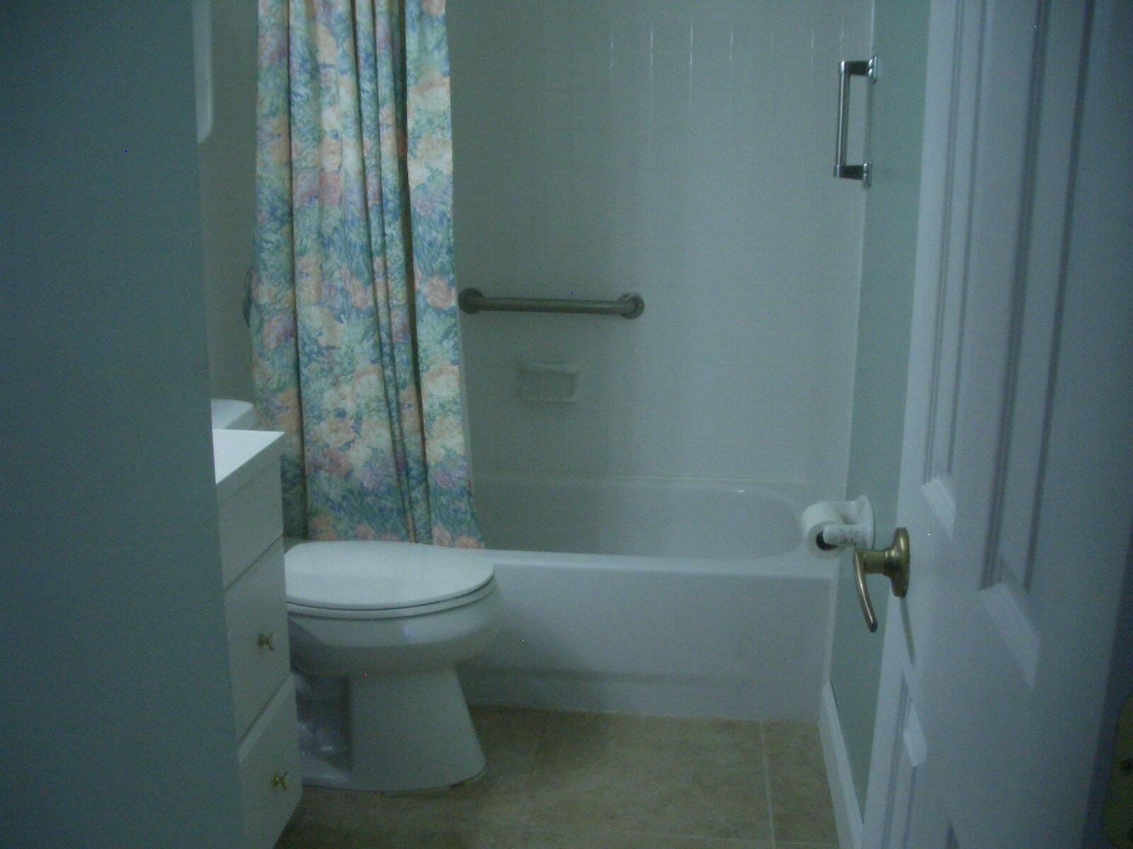 403 Daly Drive Jupiter, FL 33458 - Photo 13 of 27 a bathroom with a sink toilet and shower