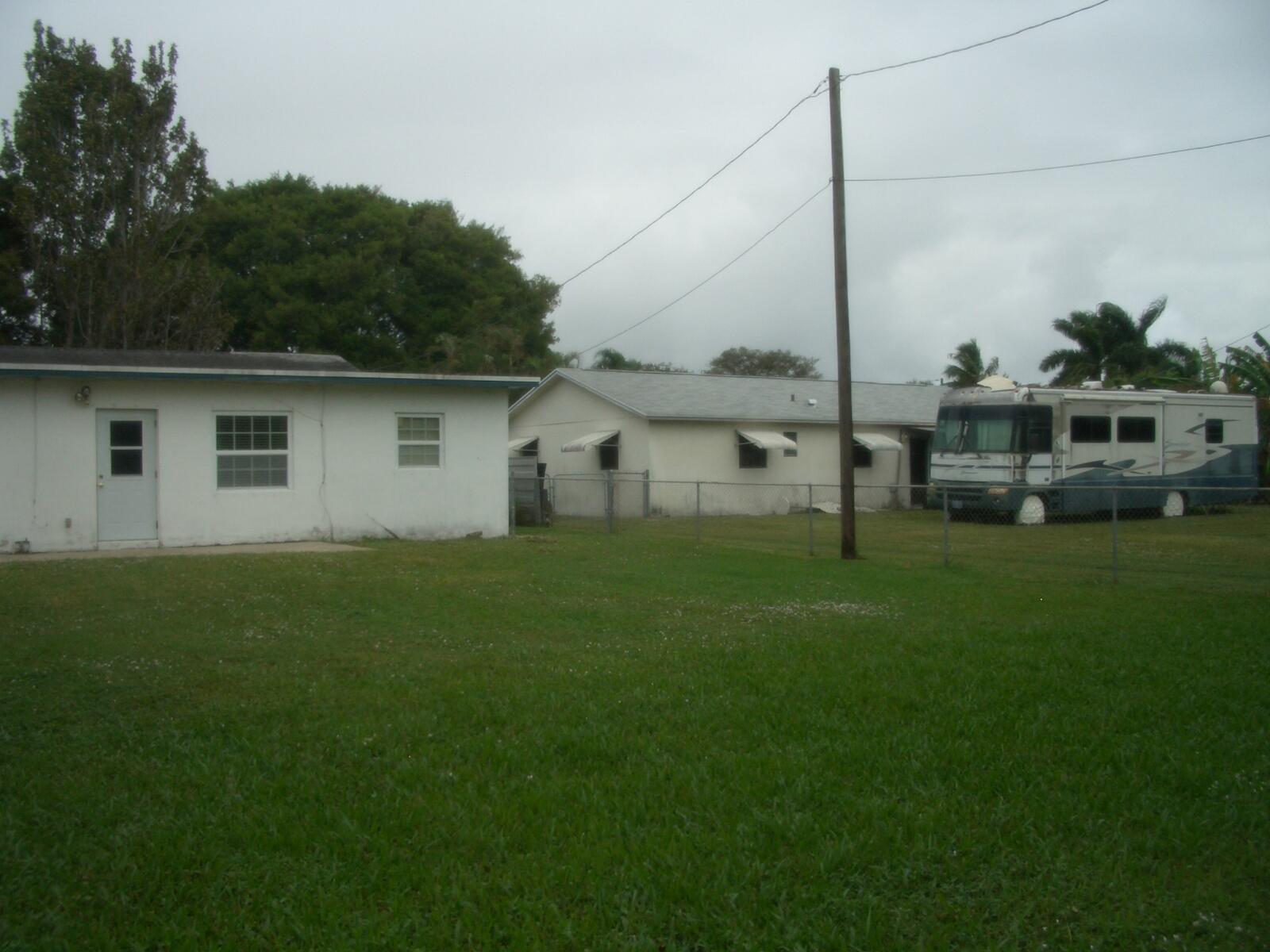 403 Daly Drive Jupiter, FL 33458 - Photo 20 of 27 a house view with a garden space