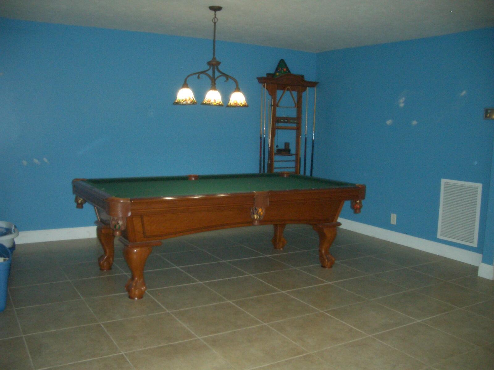 403 Daly Drive Jupiter, FL 33458 - Photo 2 of 27 a room with pool table and a chandelier